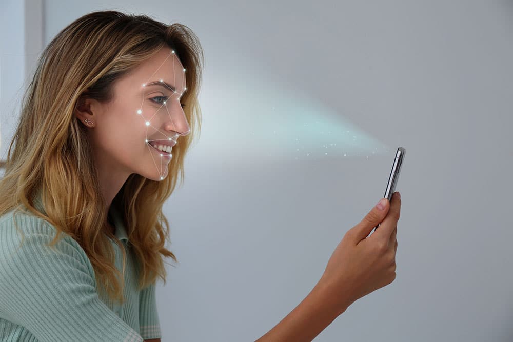 Women using mobilephone for face verification
